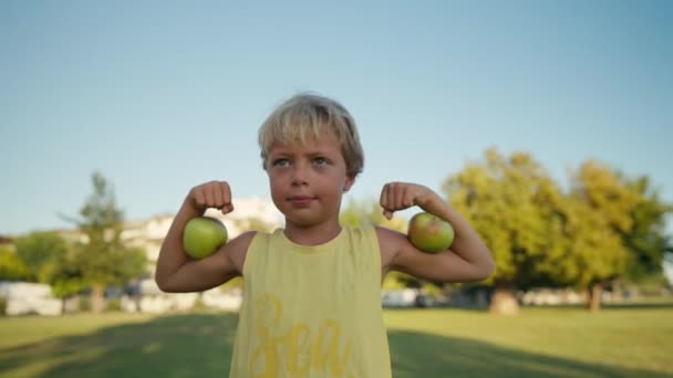Funny Boy Red Apples Shows Biceps High Quality Footage — Stock Video