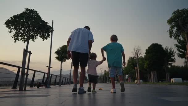 Father Son Holding Hands Walking Together Little Brother Beach Sunset — Stock video