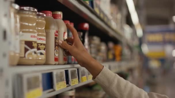 Girl Buyer Chooses Products Shelves Supermarket Buyer Examines Product Jar — Stock Video