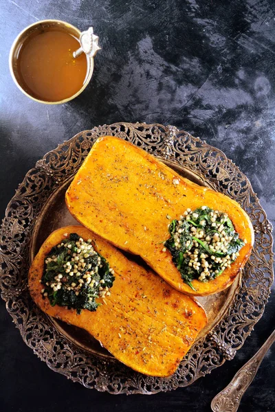 Baked Butternut Squash Stuffed with Spinach and Buckwheat Groats - healthy vegan meal