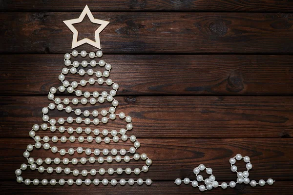 Vánoční Stromek Korálků Hvězdou Vrcholu Dřevěném Pozadí — Stock fotografie