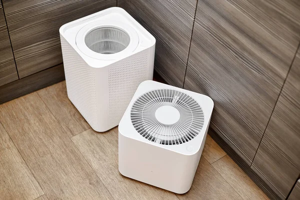 White unassembled air purifier in the kitchen of the apartment