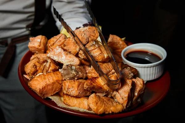 Waiter Holding Large Platter Grilled Salmon Pieces Close Selective Focus — ストック写真