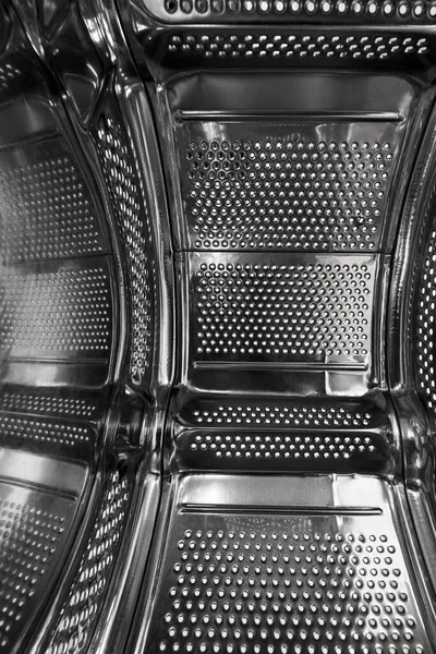 Close-up of inside of a steel washing machine drum