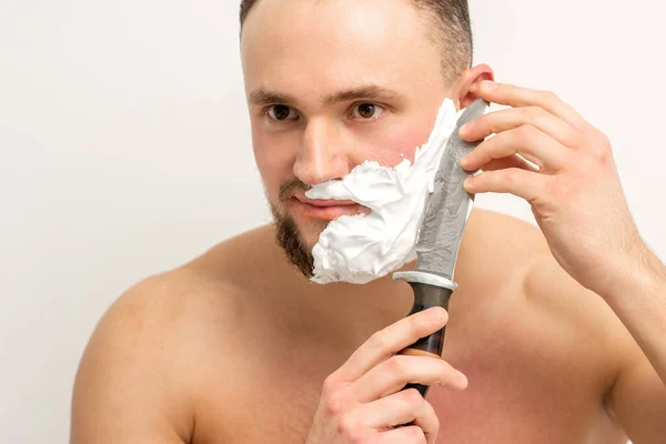 Young Caucasian Man Shaving Beard Big Knife White Background — Stock Photo, Image