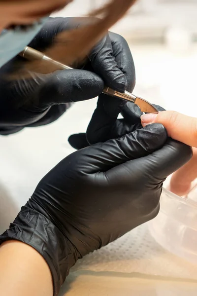 Close Professional Manicurist Master Holding Customer Hand While Using Cuticle — Stock Photo, Image