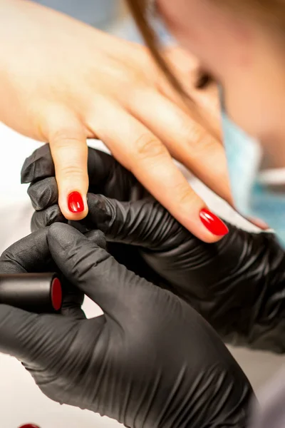 Manicure Varnish Painting Close Manicure Master Wearing Rubber Black Gloves — стоковое фото