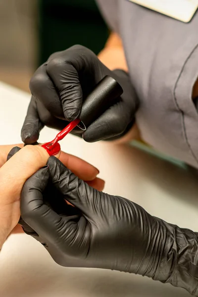 Professional Manicure Manicurist Painting Female Nails Client Red Nail Polish — Fotografia de Stock