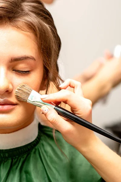 Makeup Artist Applies Cosmetic Tonal Foundation Face Using Makeup Brush — Stock fotografie