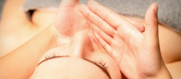 Beautiful Caucasian Young Woman Receiving Facial Massage Closed Eyes Spa — Stock Photo, Image