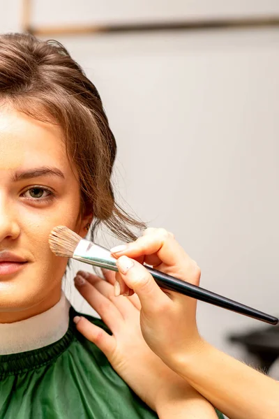 Makeup Artist Applies Cosmetic Tonal Foundation Face Using Makeup Brush — Zdjęcie stockowe