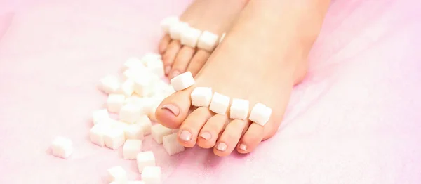 Concept Epilation Waxing Sugar Cubes Lying Row Female Feet Toes — Stockfoto