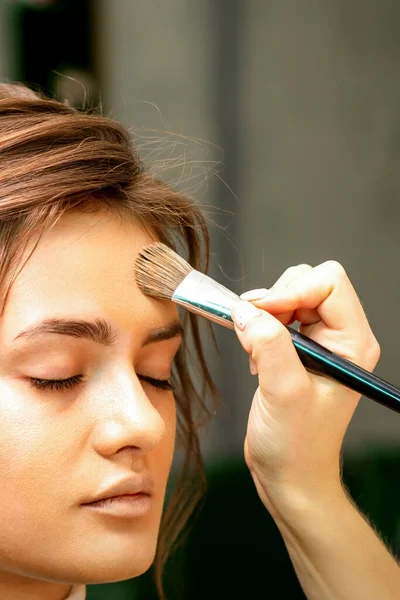 Makeup Artist Applies Cosmetic Tonal Foundation Face Using Makeup Brush — Stockfoto