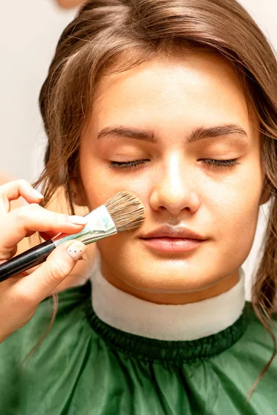 Makeup Artist Applies Cosmetic Tonal Foundation Face Using Makeup Brush — Stock fotografie