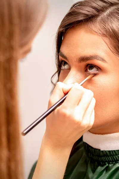 Makeup Artist Applies Concealer Eyes Using Makeup Brush — Foto Stock