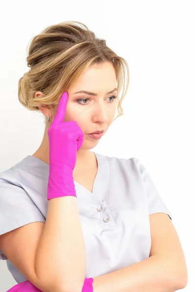 Young Caucasian Female Doctor Wearing Gloves Thoughtful Looking Away Isolated — Photo