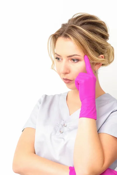 Young Caucasian Female Doctor Wearing Gloves Thoughtful Looking Away Isolated — Photo