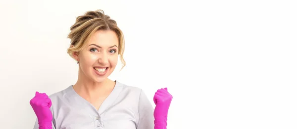 Happy Caucasian Woman Doctor Wearing Pink Gloves Celebrates Raising Fists — Zdjęcie stockowe