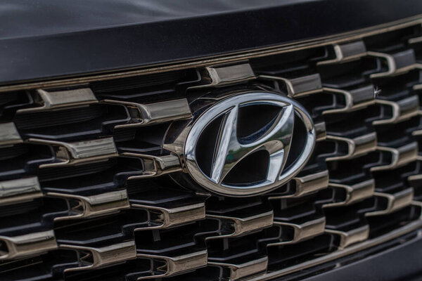 MOSCOW, RUSSIA - MAY 23, 2021 Hyundai company logo close-up view on the car grill. Logo of the South Korean multinational automotive manufacturer Hyundai.