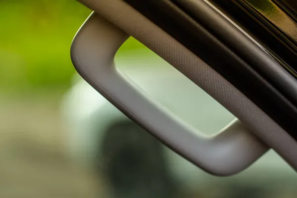 Modern Car Grab Handles, car interior details. Car grab handler for the passenger. Car ceiling handle.
