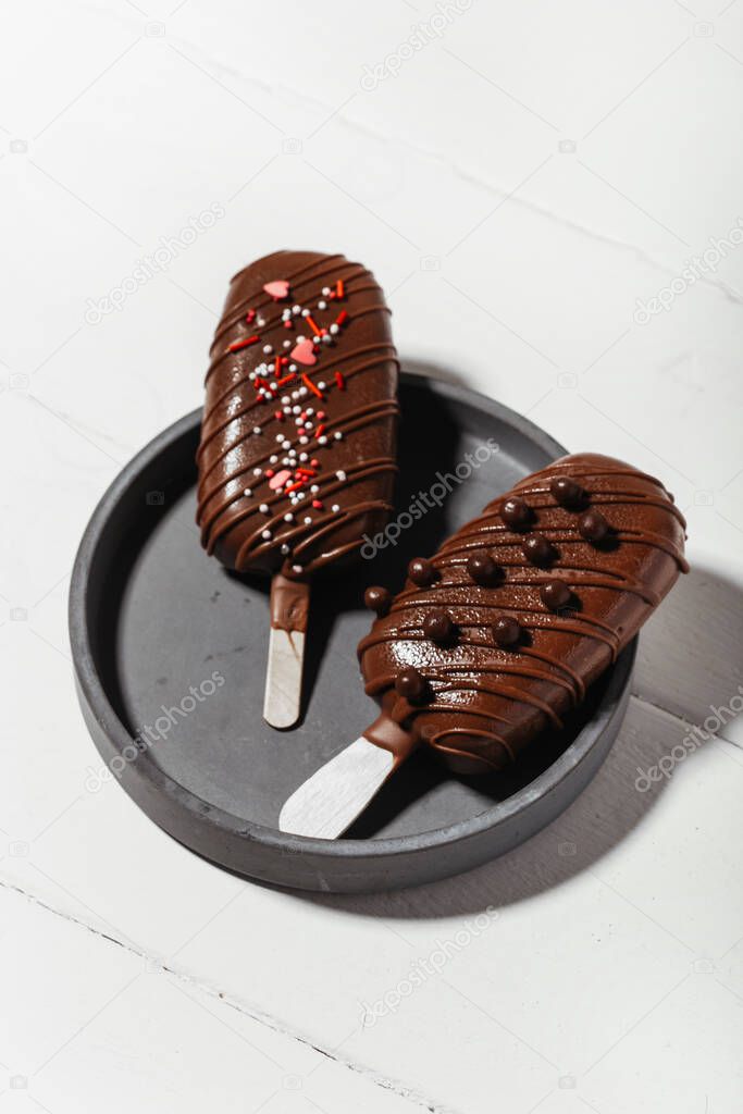chocolate popsicles on a light background