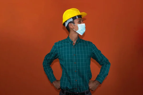 Engineer Architect Worker Yellow Helmet Pandemic Mask Isolated Orange Background — Stock Photo, Image