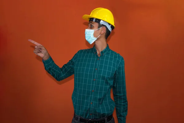 Engineer Architect Worker Yellow Helmet Pandemic Mask Isolated Orange Background — Stock Photo, Image