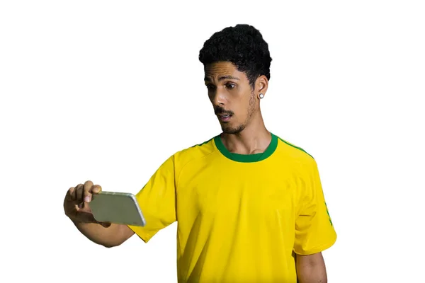 Male Athlete Fan Yellow Uniform Looking Cell Phone Isolated — Φωτογραφία Αρχείου