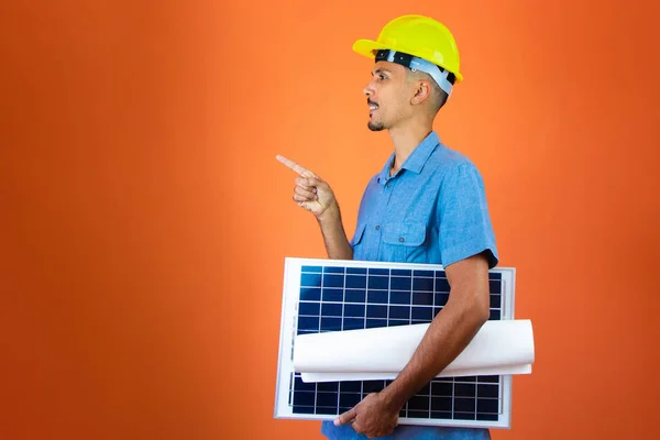 Engineers day - Black Man in Safety Helmet and Blue Shirt isolated.