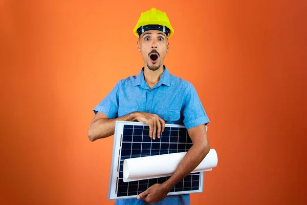 Engineers day - Black Man in Safety Helmet and Blue Shirt isolated.