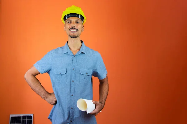 Engineers day - Black Man in Safety Helmet and Blue Shirt isolated.