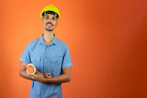 Engineers day - Black Man in Safety Helmet and Blue Shirt isolated.