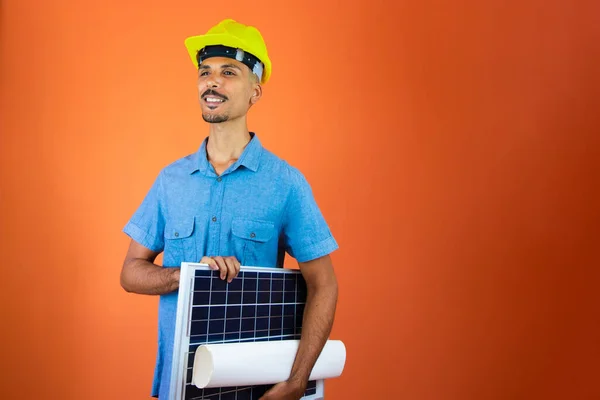 Engineers day - Black Man in Safety Helmet and Blue Shirt isolated.