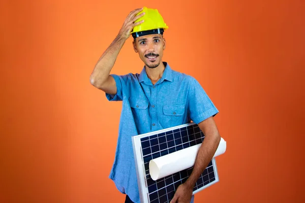 Engineers day - Black Man in Safety Helmet and Blue Shirt isolated.