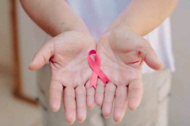 Mature White Woman With pink ribbon isolated.