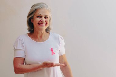 Mature White Woman With pink ribbon isolated.