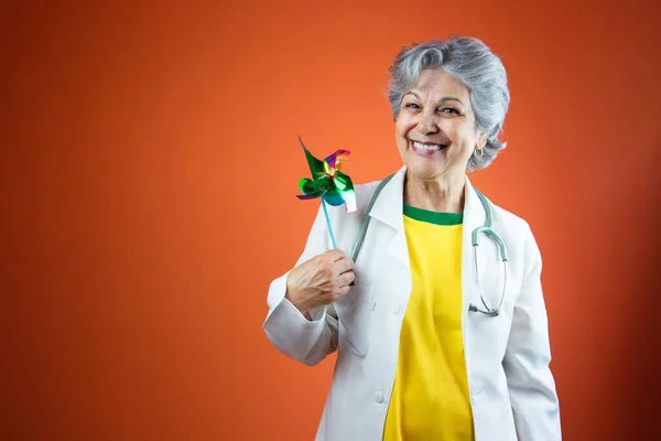 Pediatrician Day Mature Female Doctor Gray Hair Child Toys Isolated — Photo