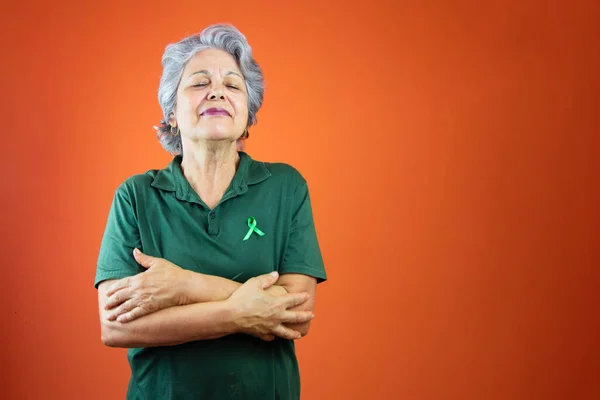 World Mental Health Day Mature Woman Gray Hair Green Ribbon — ストック写真