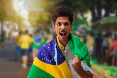 Handsome Black Young Man Holding Brazil Flag on Cinematic Background
