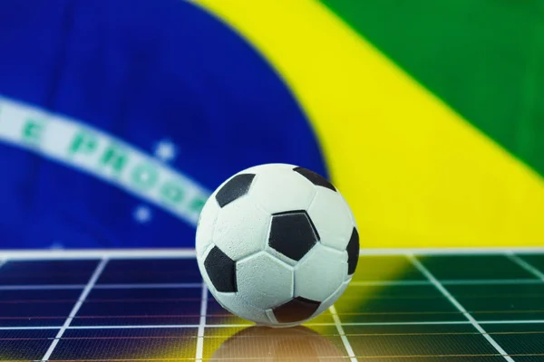 Ποδόσφαιρο Μπάλα Και Βραζιλία Σημαία Πάνω Από Φωτοβολταϊκά Ηλιακά Πάνελ — Φωτογραφία Αρχείου