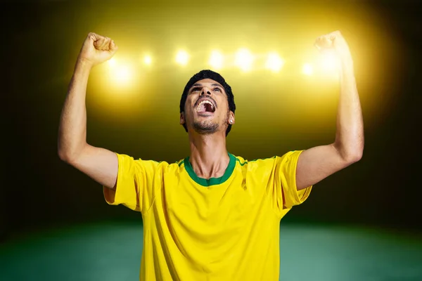 Afro Brazilian Man With Yellow Shirt Soccer team for the 2022 Cup, cheering for Brazil to be the champion.