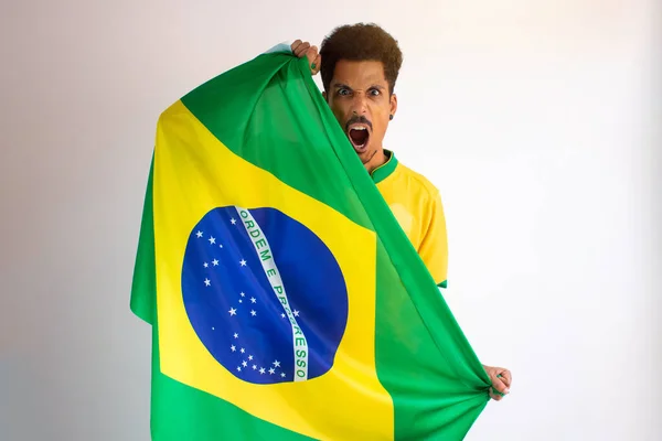 Brazilian Black Man Fan with Soccer Team Shirt Isolated on White. Sport Fan With Flag Celebrating the Cup.