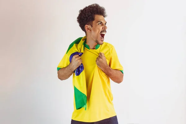 Brazilian Black Man Fan with Soccer Team Shirt Isolated on White. Sport Fan With Flag Celebrating the Cup.