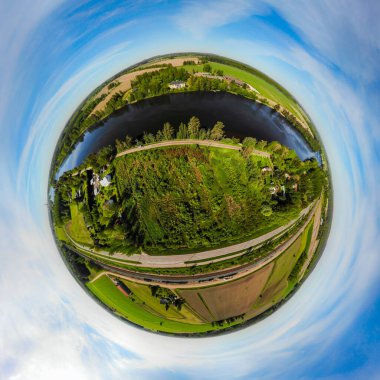 A three dimensional aerial panoramic view of river Kymijoki bank with beautiful wooden Rabbelugn Manor - Takamaan Kartano. clipart