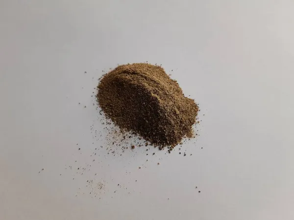 Pile Black Ground Pepper Sprinkled White Background — Stock Photo, Image