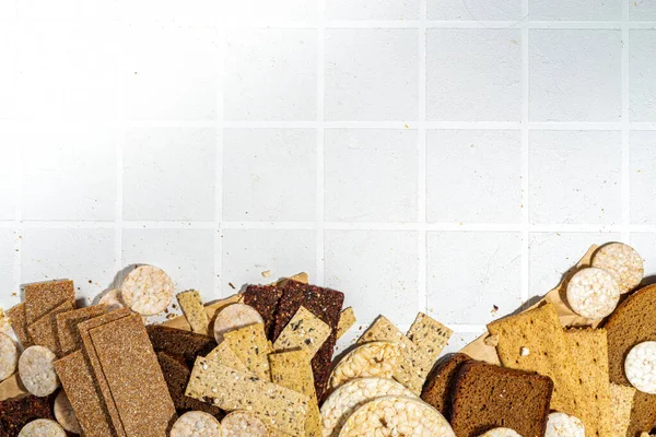 Gluten free allergic diet, celiac disease concept. Collection of various non-gluten different bread, whole grain loaves. Healthy alternative to bread, flatlay copy space