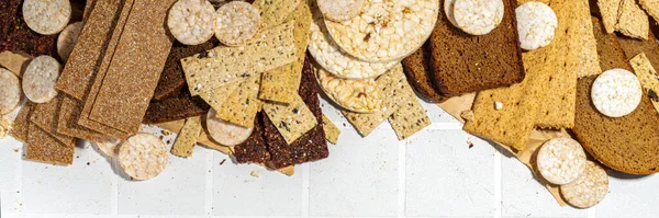 Gluten free allergic diet, celiac disease concept. Collection of various non-gluten different bread, whole grain loaves. Healthy alternative to bread, flatlay copy space