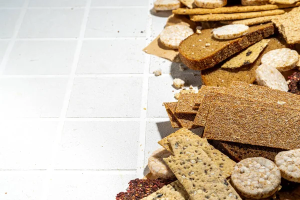 Gluten free allergic diet, celiac disease concept. Collection of various non-gluten different bread, whole grain loaves. Healthy alternative to bread, flatlay copy space