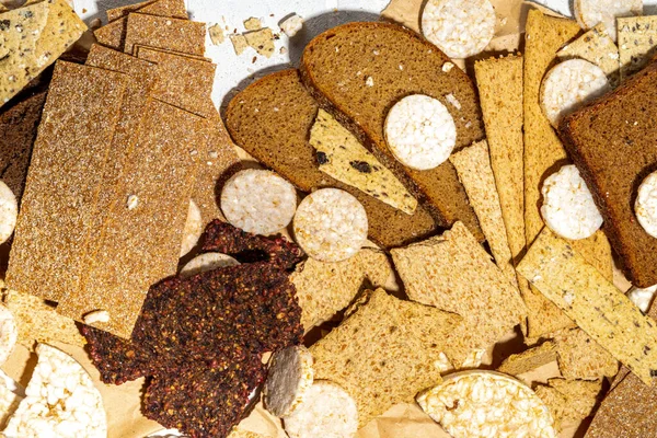 Gluten free allergic diet, celiac disease concept. Collection of various non-gluten different bread, whole grain loaves. Healthy alternative to bread, flatlay copy space