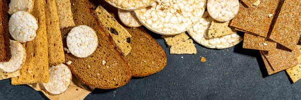 Gluten free allergic diet, celiac disease concept. Collection of various non-gluten different bread, whole grain loaves. Healthy alternative to bread, flatlay copy space